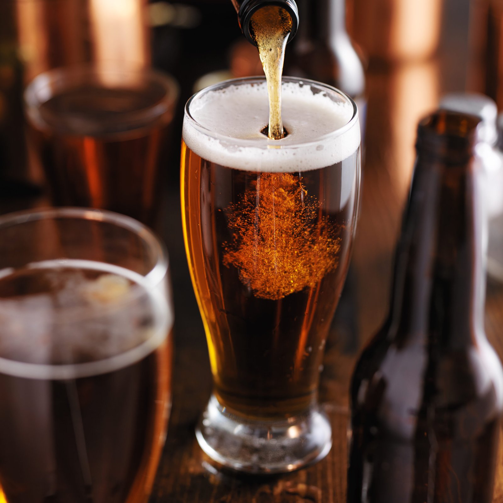 Bartender pouring a cold craft beer at Black Harbor Brewing Co. in Boston's Seaport District